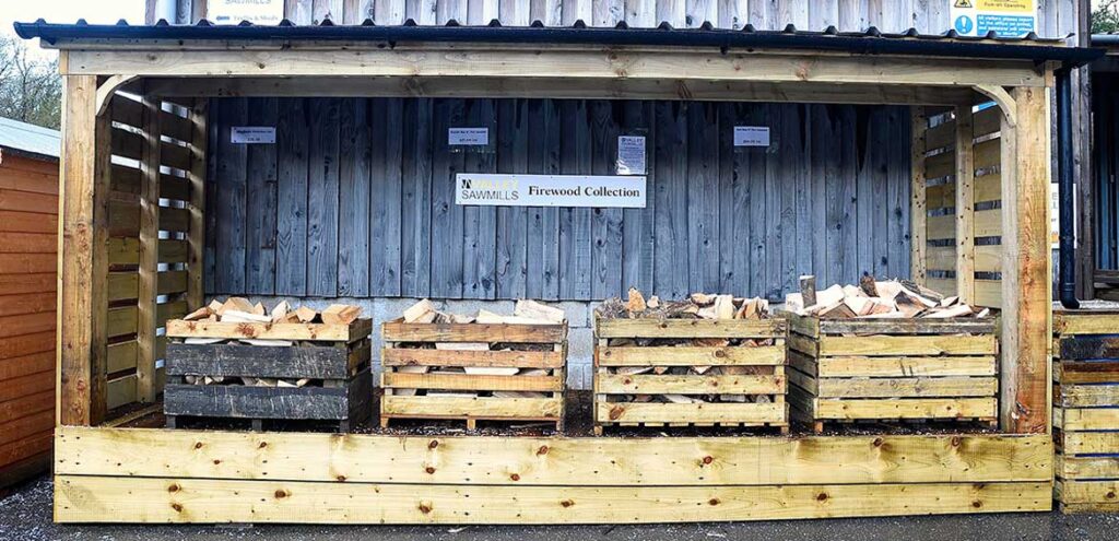 Crates of firewood in the covered log store at the Valley yard in Holwell, ready to collect